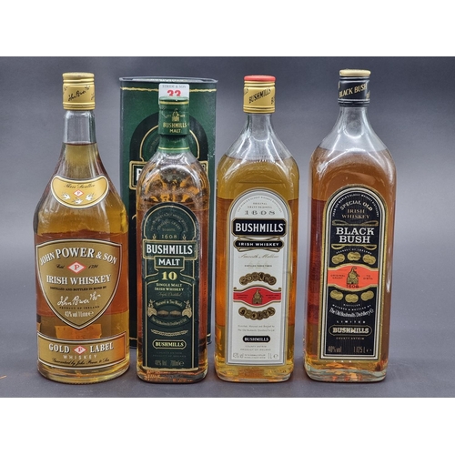 33 - Three bottles of Bushmills Irish Whiskey, comprising: a 1 litre, (seal broken); a 70cl 10 year old, ... 