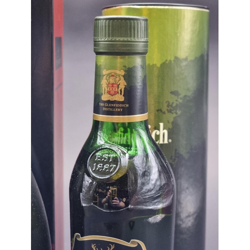 39 - A 70cl bottle of Remy Martin VSOP Fine Champagne Cognac, in card box; together with a 50cl bottle of... 