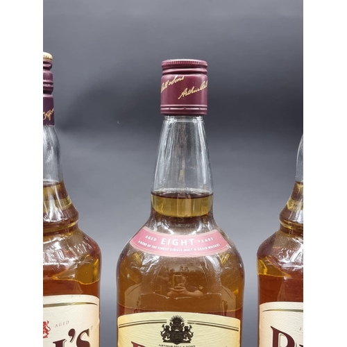 52 - Three 1 litre bottles of Bell's blended Whisky. (3)