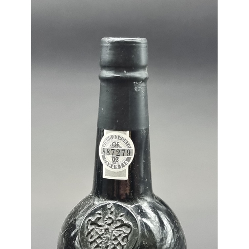 69 - Three bottles of Port, comprising: a 75cl Fonseca Guimaraens 1987 Vintage; a Waitrose 1995 LBV; and ... 