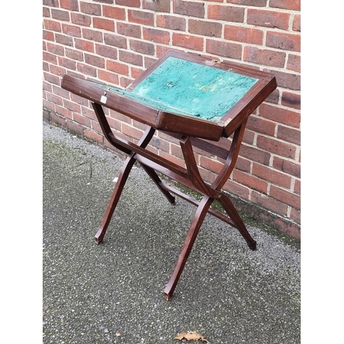 1025 - An early 20th century mahogany folding campaign desk, 61cm wide.