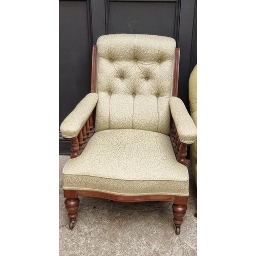 1075 - A late Victorian mahogany and button upholstered armchair. 