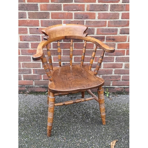 1084 - An Edwardian beech and elm smoker's bow chair.