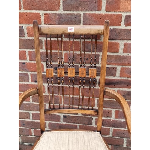 1087 - An Arts & Crafts style mahogany and inlaid open arm elbow chair.