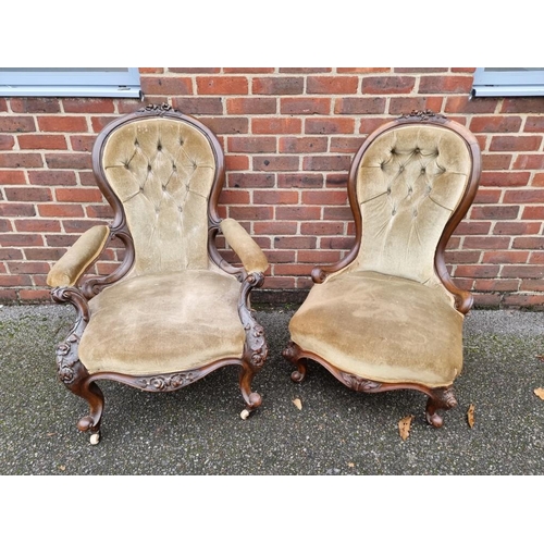 1090 - A pair of Victorian carved walnut and button upholstered occasional chairs.