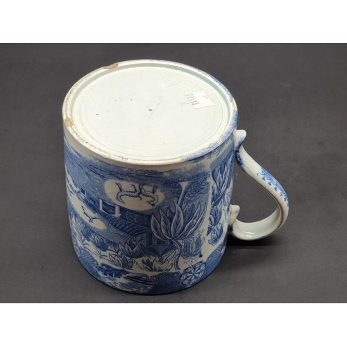 1480 - A 19th century English blue and white pottery tankard, printed with a stylised landscape, 12.5cm hig... 