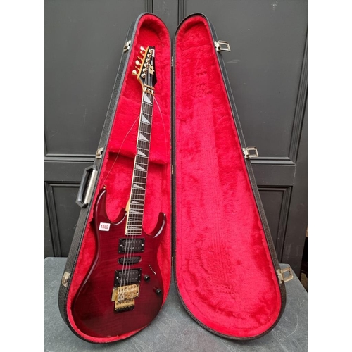 1502 - An Ibanez EX370/FTP electric guitar, in padded case.