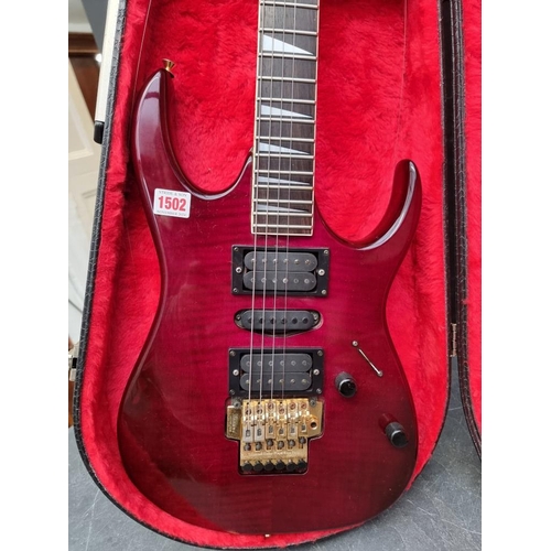 1502 - An Ibanez EX370/FTP electric guitar, in padded case.