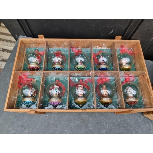 1506 - A collection of sixteen Thomas Pacconi Christmas tree baubles, in two pine crates.... 