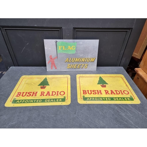 1519 - Two painted metal 'Bush Radio' signs, 34.5 x 46cm; together with another. (3)