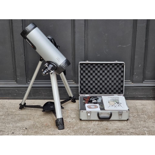 1520 - A Celestron 114LCM telescope, with instruction manual and related.