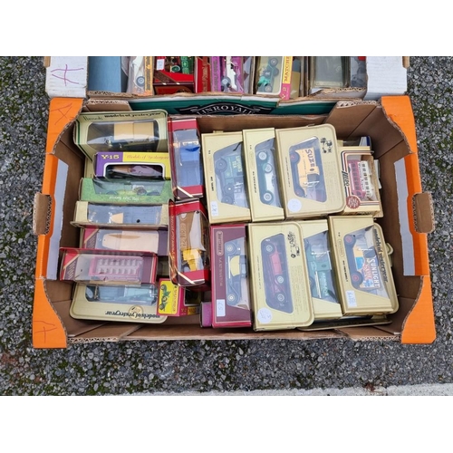 1529 - A collection of boxed model vehicles, to include examples by Matchbox. (three boxes)... 