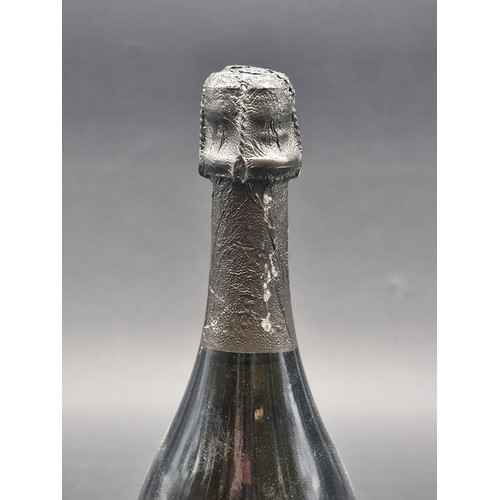 67 - A 70cl bottle of Moet et Chandon Dom Perignon 1985 Vintage Champagne, (small tear to label).... 