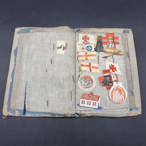 249 - WORLD WAR I CHARITY PINS: cloth album containing circa 100 paper, fabric and metallic charity p... 