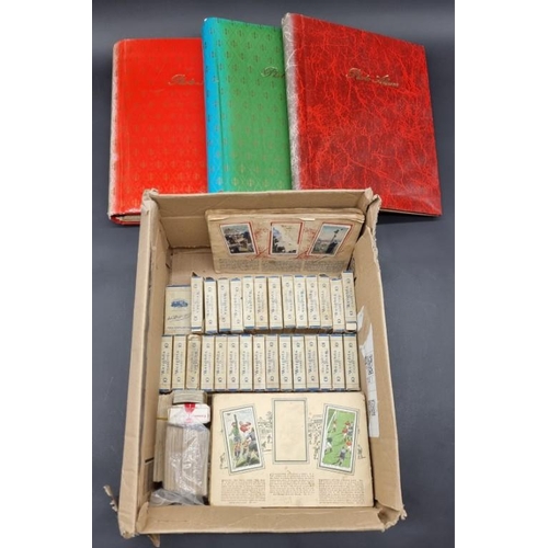 480 - CIGARETTE CARDS/PACKAGING: three albums containing vintage cigarette packaging: together with a... 