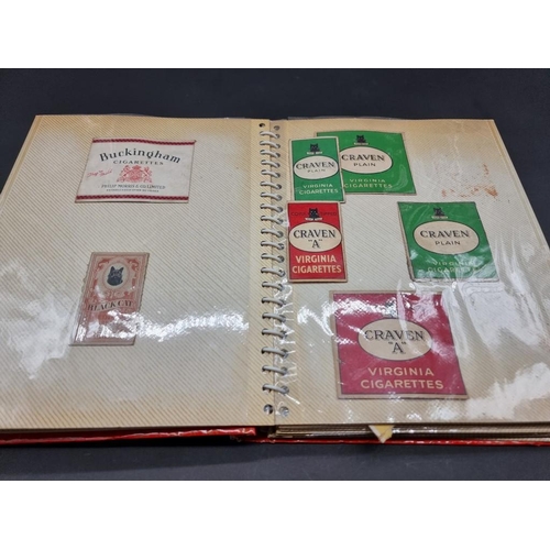 480 - CIGARETTE CARDS/PACKAGING: three albums containing vintage cigarette packaging: together with a... 