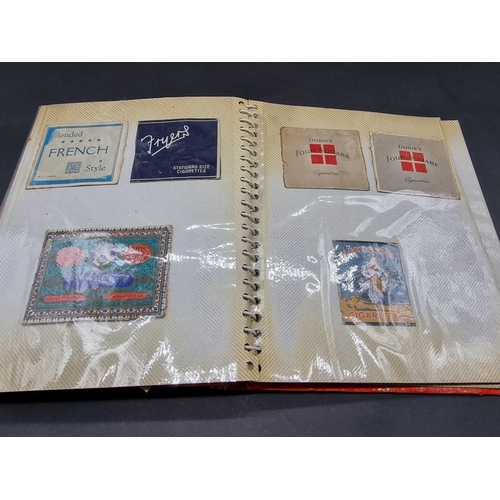 480 - CIGARETTE CARDS/PACKAGING: three albums containing vintage cigarette packaging: together with a... 