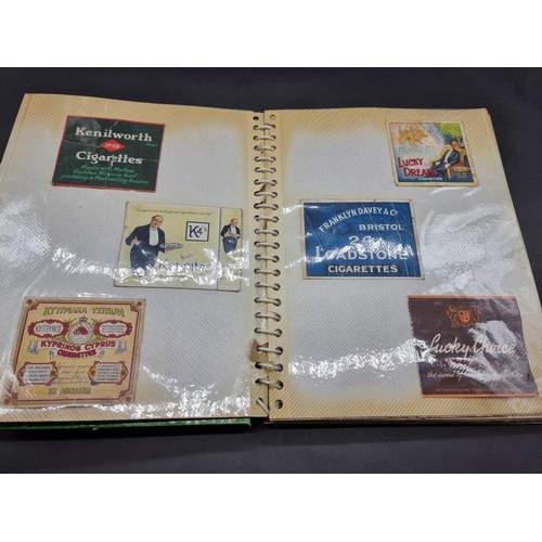 480 - CIGARETTE CARDS/PACKAGING: three albums containing vintage cigarette packaging: together with a... 