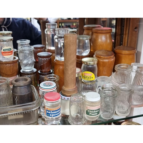 498 - SHIPPAM'S OF CHICHESTER: a shelf of Shippam's pots and packaging, including manufacturer's dumm... 