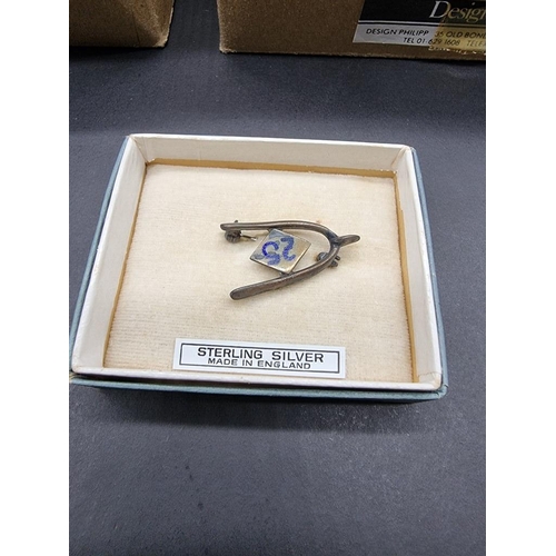 502 - SHIPPAM'S OF CHICHESTER: a large collection of sterling silver novelty wishbone brooches and pairs o... 