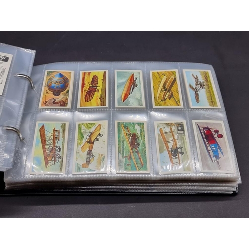 531 - CIGARETTE & TEA CARDS: a large collection, neatly arranged in 18 modern albums, to include ... 