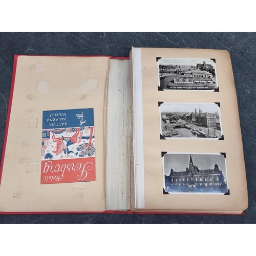 633 - SCRAPBOOK: postcards and ephemera from Scandinavian travels circa 1950: red cloth covers, some wear:... 