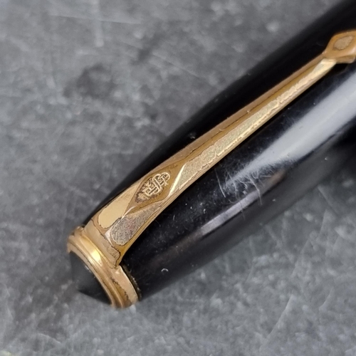 10 - A circa 1954-58 Conway Stewart 100 black fountain pen, 14ct gold nib.