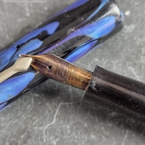 11 - A circa 1952-54 Conway Stewart blue/black 'candle flame' fountain pen, 14ct gold nib... 