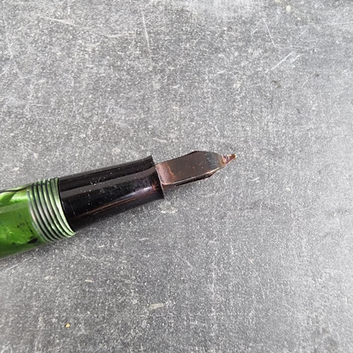 13 - Two circa 1952-63 Conway Stewart 15 marbled fountain pens, comprising plum and green examples, 12.7c... 