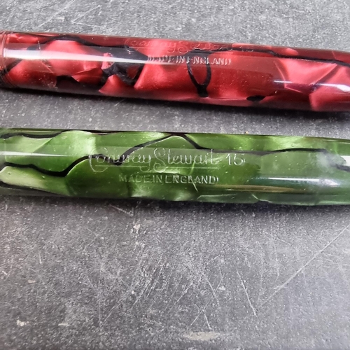13 - Two circa 1952-63 Conway Stewart 15 marbled fountain pens, comprising plum and green examples, 12.7c... 