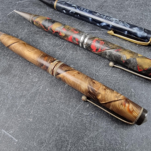 22 - Three vintage Conway Stewart propelling pencils, comprising: a 'Nippy' marbled blue example, (inscri... 