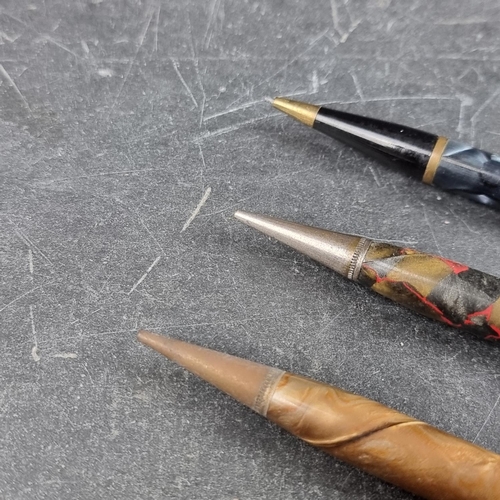 22 - Three vintage Conway Stewart propelling pencils, comprising: a 'Nippy' marbled blue example, (inscri... 