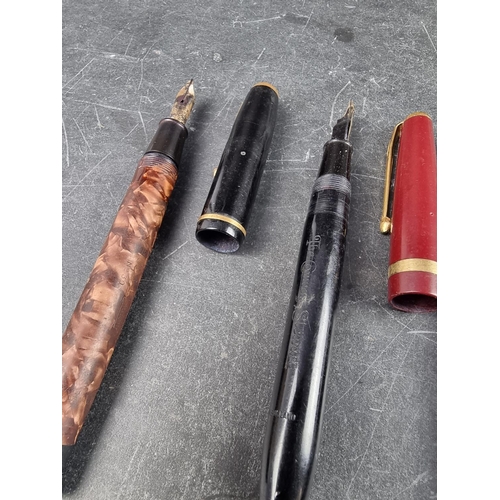 Seven vintage Conway Stewart fountain pens, comprising: 106 red
