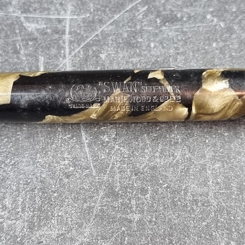 36 - A 1930s/40s Mabie Todd & Co Swan 'Self-Filler' marbled green fountain pen, no band, non-plated f... 