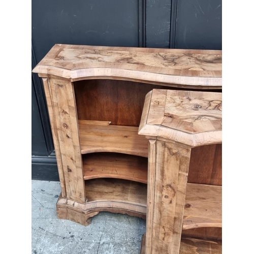 1013 - A pair of walnut and crossbanded open bookcases, 114.5cm wide.