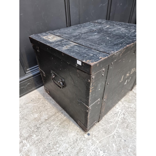 1015 - A Victorian ebonised and metal bound trunk, inscribed 'J.S. Doyle', 69cm wide.