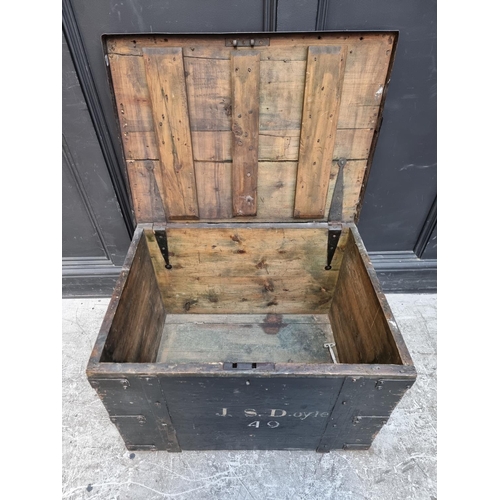 1015 - A Victorian ebonised and metal bound trunk, inscribed 'J.S. Doyle', 69cm wide.