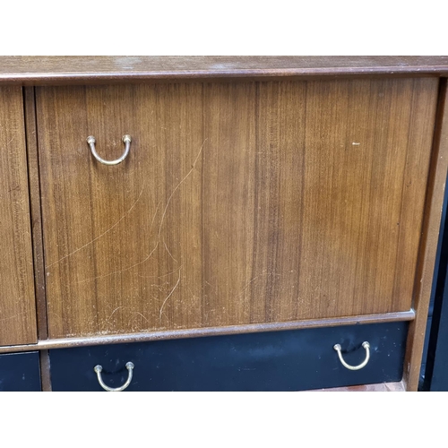 1018 - A mid-century G-Plan 'Librenza' dining suite, comprising: a drop leaf table, 137.5cm; a sideboard, 1... 