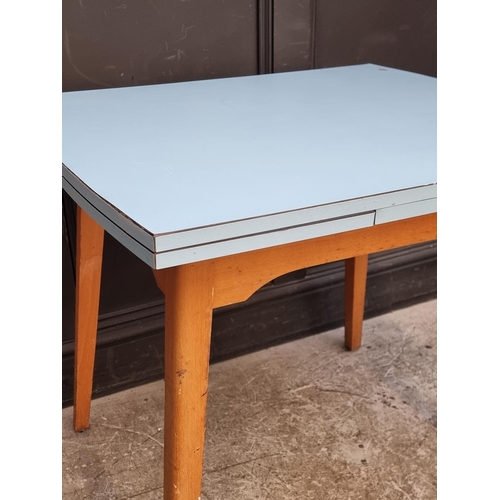 1021 - A mid-century melamine top drawer-leaf table, 135cm extended; together with another similar drop lea... 