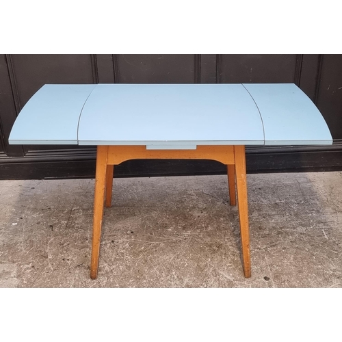 1021 - A mid-century melamine top drawer-leaf table, 135cm extended; together with another similar drop lea... 