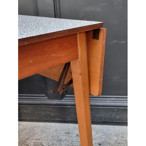 1021 - A mid-century melamine top drawer-leaf table, 135cm extended; together with another similar drop lea... 