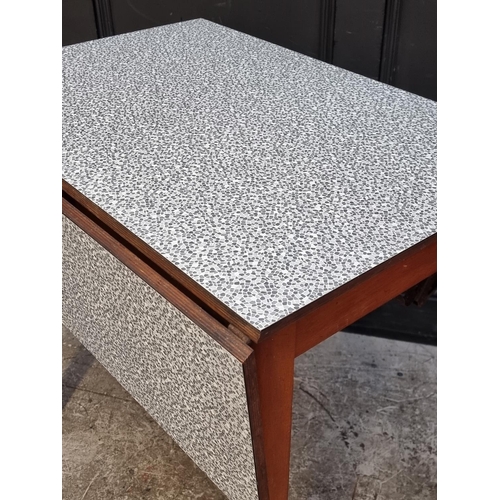 1021 - A mid-century melamine top drawer-leaf table, 135cm extended; together with another similar drop lea... 