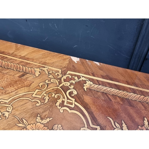 1023 - A Continental marquetry card table, 73cm wide.