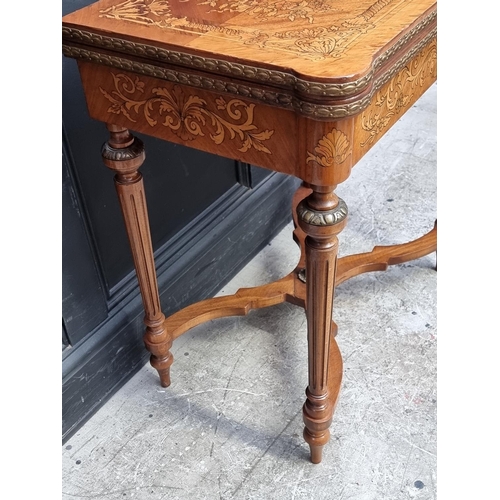 1023 - A Continental marquetry card table, 73cm wide.