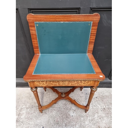 1023 - A Continental marquetry card table, 73cm wide.