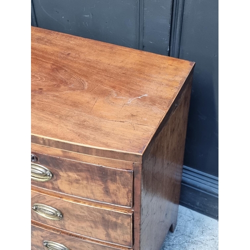 1031 - A small early 19th century bowfront chest of drawers, 96cm wide.