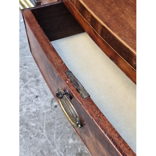 1031 - A small early 19th century bowfront chest of drawers, 96cm wide.