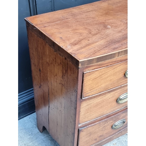 1031 - A small early 19th century bowfront chest of drawers, 96cm wide.