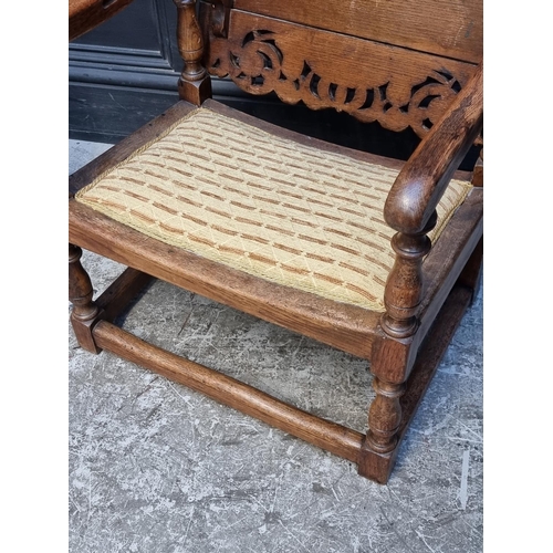 1037 - A pair of unusual oak monk's bench style chairs, 52.5cm wide.