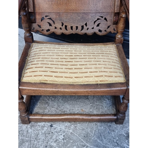 1037 - A pair of unusual oak monk's bench style chairs, 52.5cm wide.